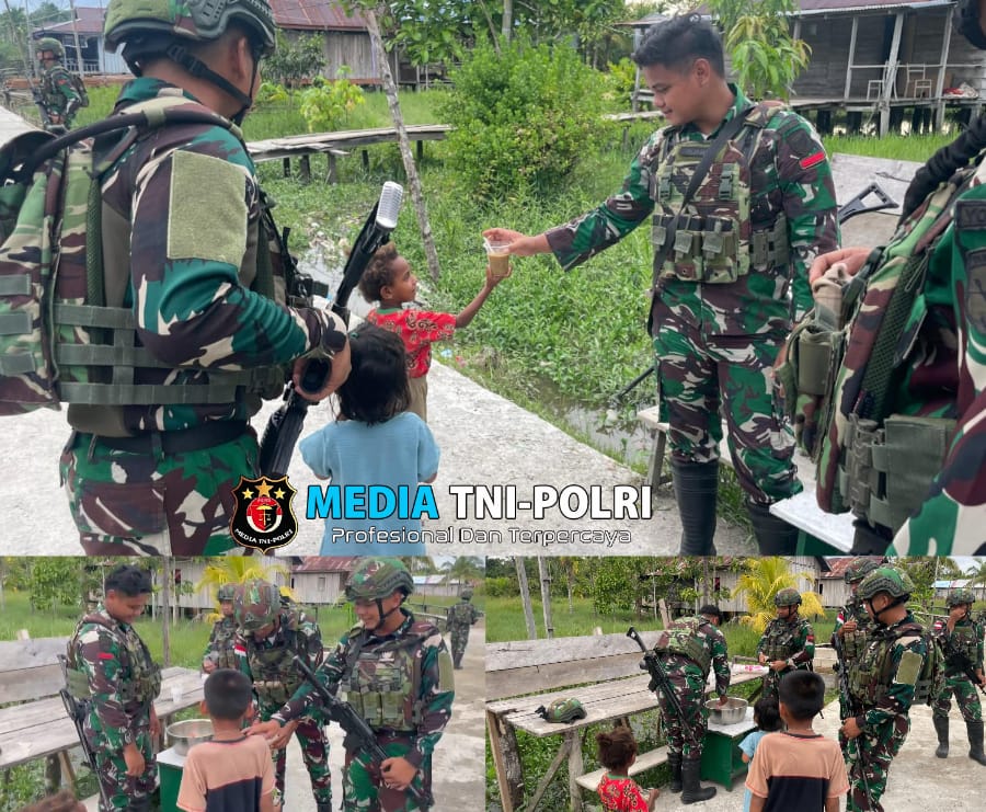 Pos Kamundan Satgas Yonif 642/Kps Bagikan Bubur Kacang Ijo Kepada Anak-Anak di Distrik Kamundan