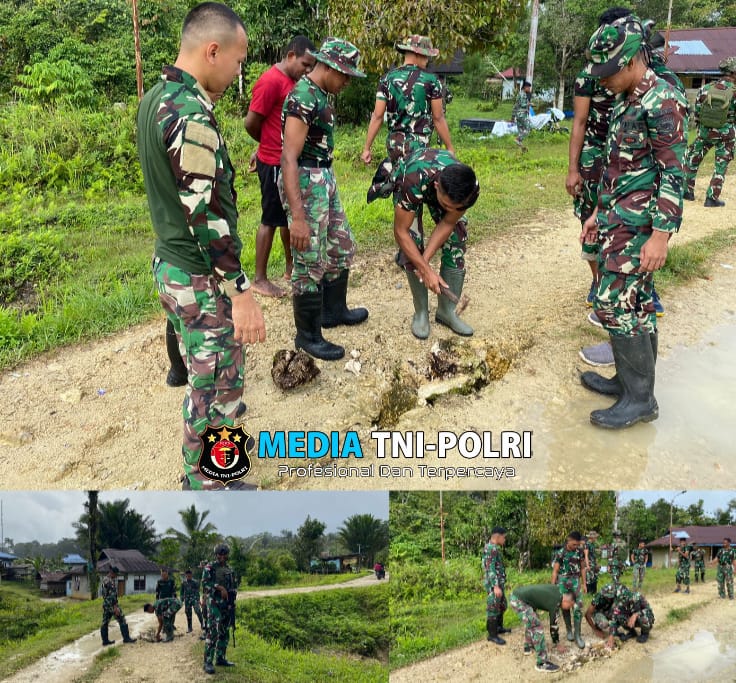 Satgas Yonif 762/VYS Memperbaiki Jalan di Kampung Bori