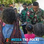 Satgas Yonif 521/DY Satu Iman dan Jemaat Bersujud dalam Damai di Gereja Katolik Stasi Santo Paulus Tanah Walesi