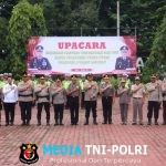 Kapolres Langkat Pimpin Upacara Kenaikan Pangkat Pengabdian dan Pelepasan Personel Purna Tugas