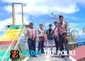 Di Balik Senyum Ramah Aipda Rolan Manik Sosok Personel Sat Pam Obvit Polres Simalungun yang Tak Kenal Lelah Kawal Keamanan Wisata Danau Toba