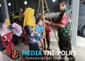 Wujud Babinsa Tawangrejo Dampingi Kegiatan Posyandu, Demi Tingkatkan Layanan Kesehatan Masyarakat