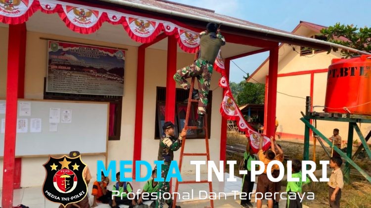 Tanamkan Jiwa Nasionalisme, Pos Sei Tekam Satgas Yonarmed 13/Nanggala Bersama Siswa SDN 25 Perimpah Pasang Bendera Merah Putih