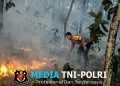 Bhabinkamtibmas Polsek Terbanggi Besar, Bripka Nasrun Harahap Gerak Cepat Padamkan Kebakaran Lahan Warga