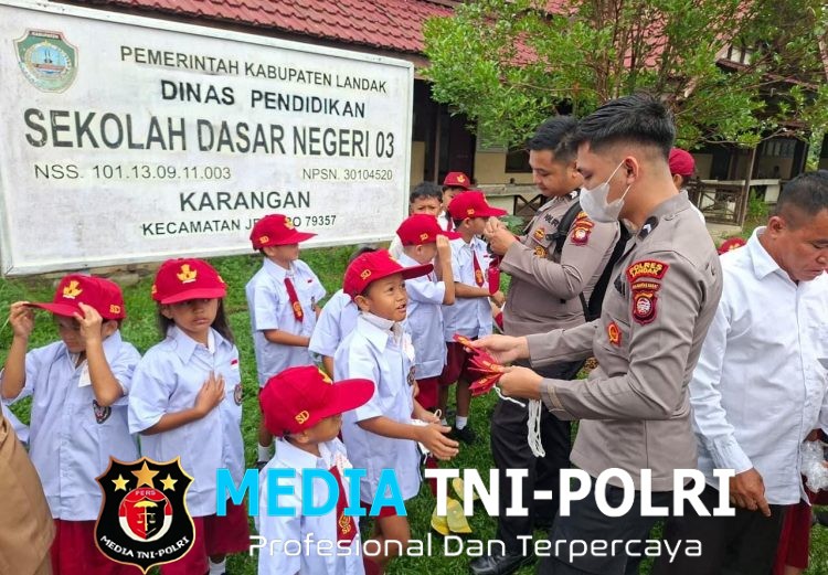 Senyum Ceria Siswa SDN 03 Karangan Sambut Kepedulian Polres Landak melalui Bantuan Seragam Sekolah