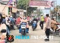 Polsek Babelan Atur Lalu Lintas Pagi di Warung Gabus Pucung, Pastikan Arus Kendaraan Tetap Lancar